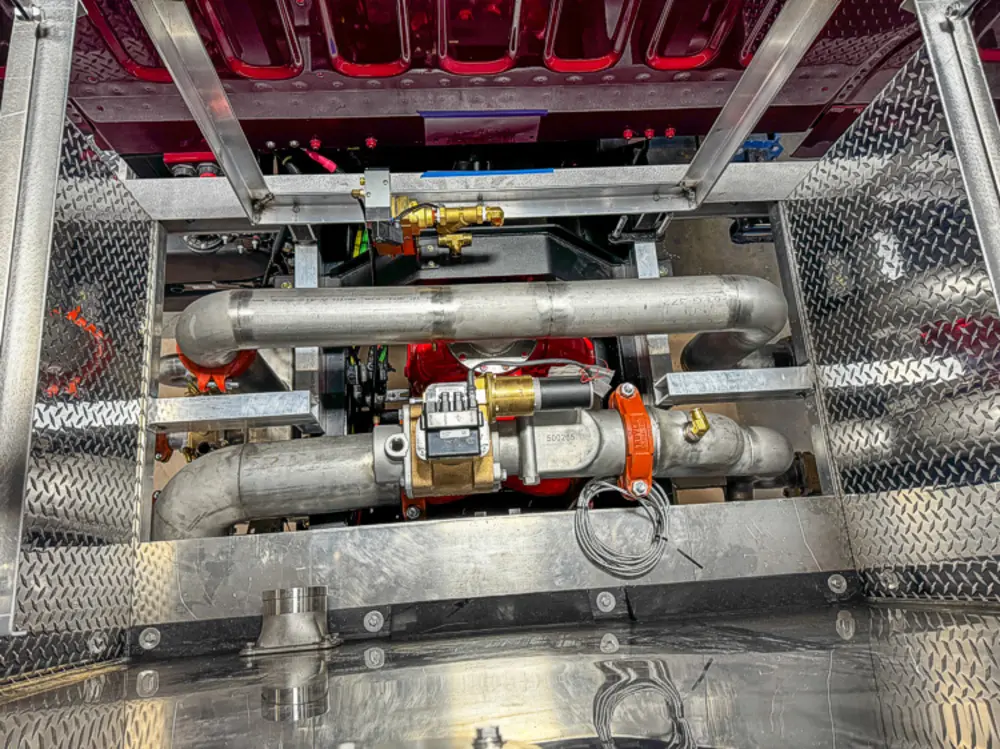 Diamond-plate body and step detail in production, photo 88 of 303.